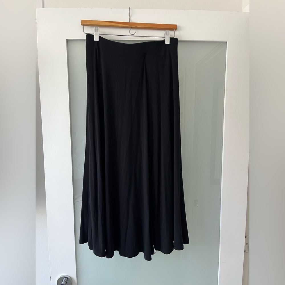 Wardrobe staple! Black jersey knit skirt with offset front slit
